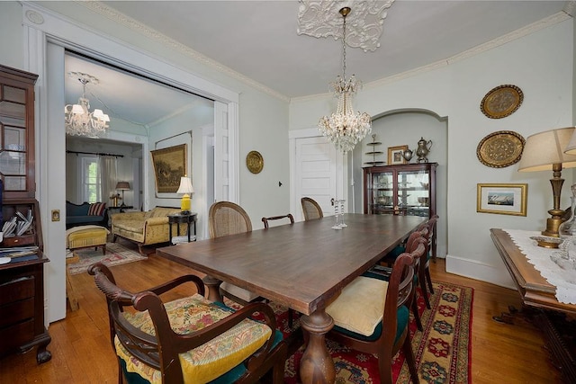 111 S Hamilton St, Poughkeepsie, NY 12601 - dining area with a chandelier, wood finished floors, and crown molding