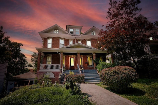 111 S Hamilton St, Poughkeepsie, NY 12601 - view of front of property with stairway, brick siding, and covered porch