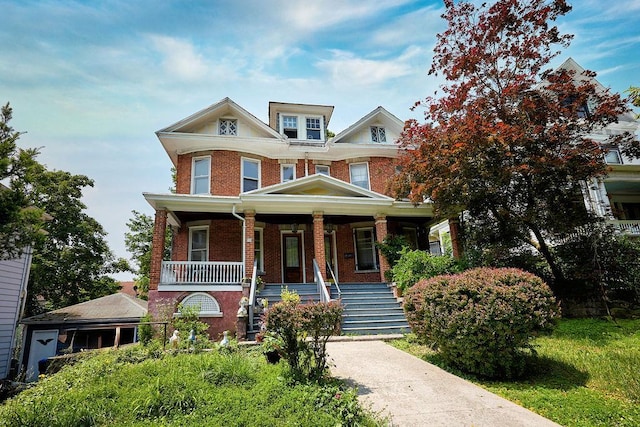 111 S Hamilton St, Poughkeepsie, NY 12601 - view of front facade featuring brick siding, stairway, and covered porch