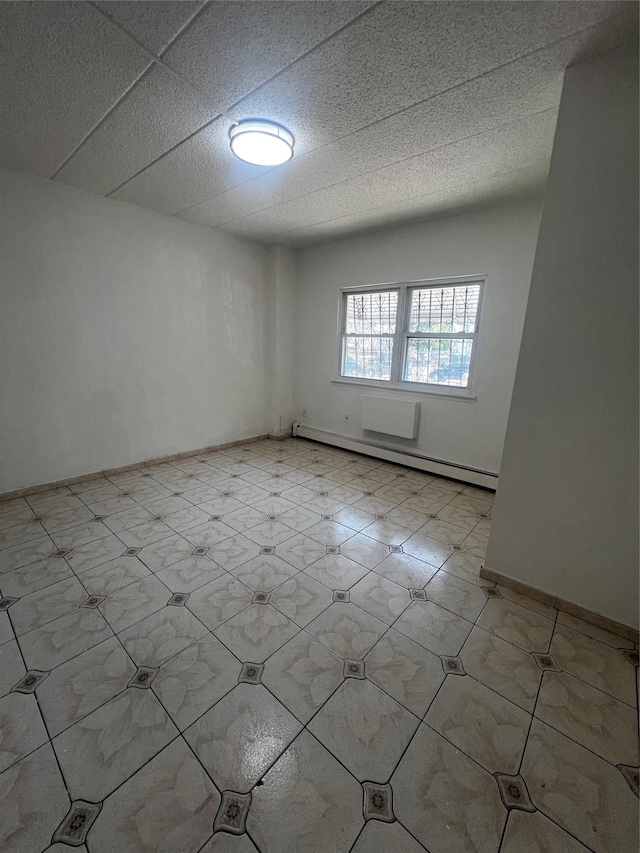 889 E 169th St, Bronx, NY 10459 - unfurnished room with a baseboard radiator