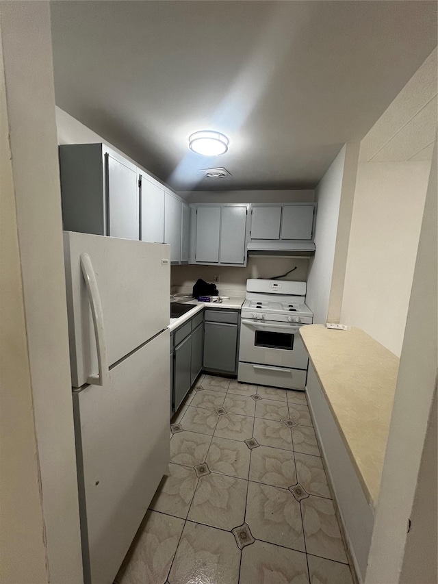 889 E 169th St, Bronx, NY 10459 - kitchen with white appliances and light countertops