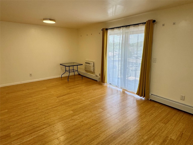 324 Concord Ln, Middletown, NY 10940 - empty room featuring light wood-style floors, baseboard heating, and a wall unit AC