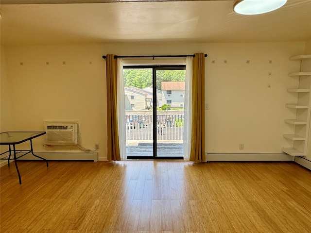324 Concord Ln, Middletown, NY 10940 - empty room featuring wood finished floors, a wall mounted air conditioner, and a baseboard heating unit