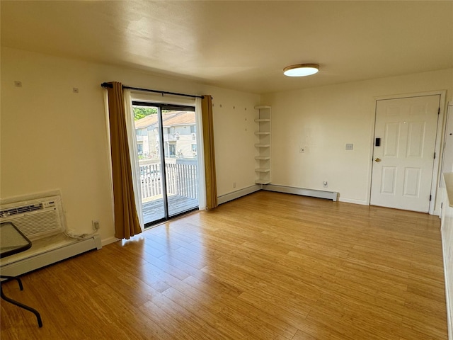 324 Concord Ln, Middletown, NY 10940 - unfurnished room with light wood-style floors, a baseboard radiator, and a wall unit AC
