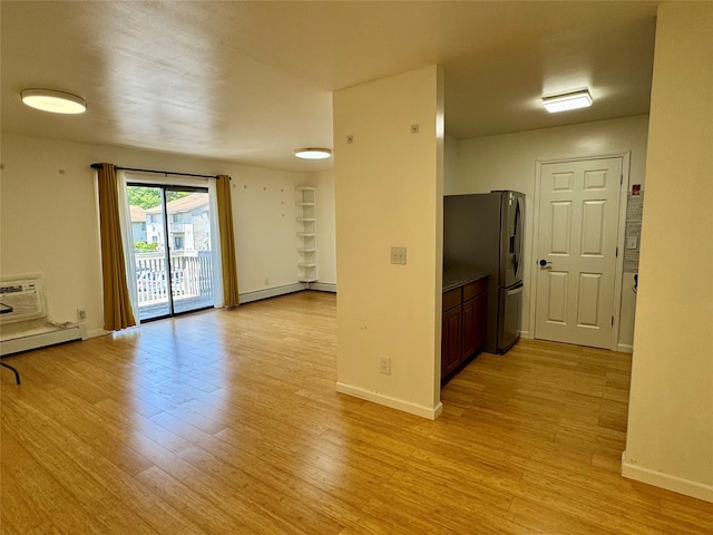324 Concord Ln, Middletown, NY 10940 - spare room featuring light wood-style floors and a baseboard radiator
