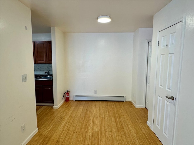 324 Concord Ln, Middletown, NY 10940 - corridor with a baseboard radiator and light wood-type flooring