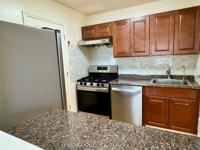 324 Concord Ln, Middletown, NY 10940 - kitchen with appliances with stainless steel finishes, under cabinet range hood, decorative backsplash, and brown cabinets