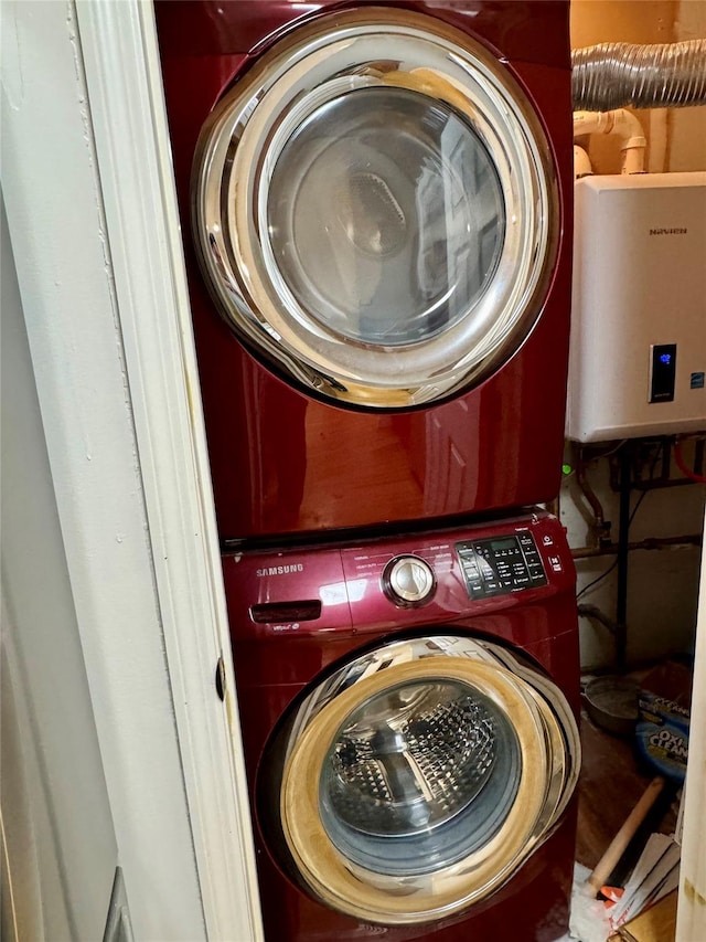 324 Concord Ln, Middletown, NY 10940 - laundry area with stacked washing machine and dryer and tankless water heater