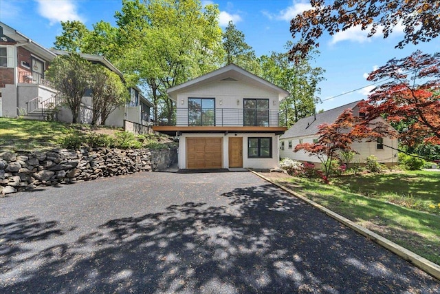 68 Ridgeview Ave, Yonkers, NY 10710 - contemporary home featuring a garage, asphalt driveway, and a balcony
