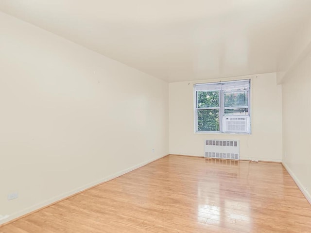 1425 Thieriot Ave Unit 2J, Bronx, NY 10460 - empty room featuring radiator, wood finished floors, and cooling unit