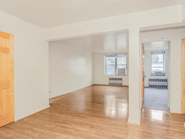 1425 Thieriot Ave Unit 2J, Bronx, NY 10460 - empty room featuring radiator heating unit and light wood-style flooring