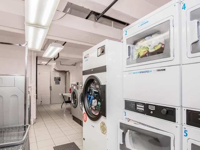 1425 Thieriot Ave Unit 2J, Bronx, NY 10460 - community laundry with stacked washer / dryer, light tile patterned flooring, and washer and clothes dryer