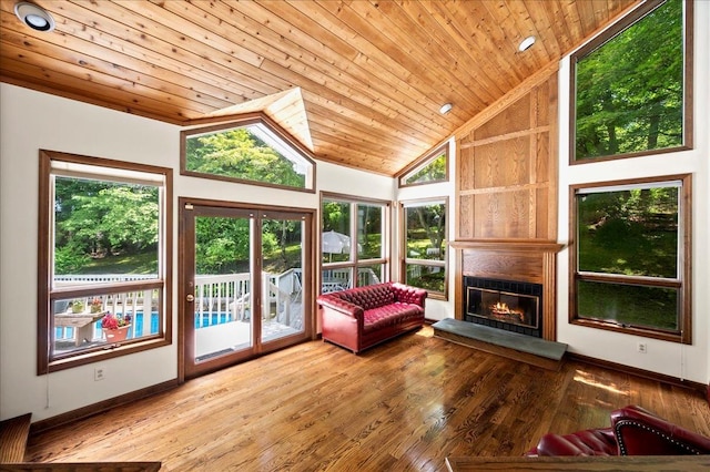 205 Radcliff Dr, Nyack, NY 10960 - living room featuring wooden ceiling, healthy amount of natural light, a large fireplace, hardwood / wood-style flooring, and high vaulted ceiling