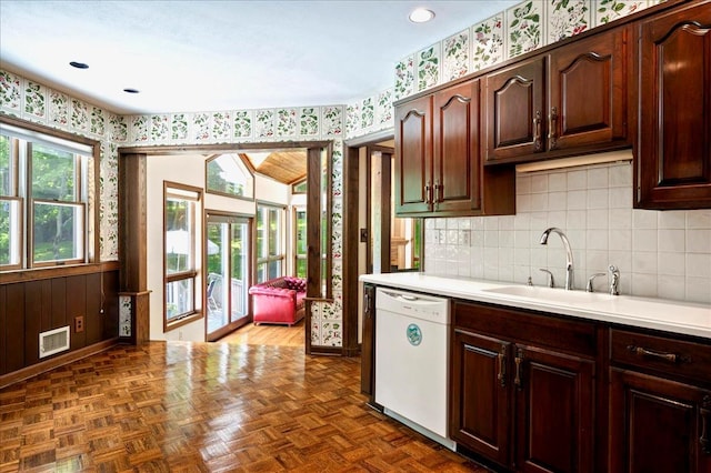 205 Radcliff Dr, Nyack, NY 10960 - kitchen with white dishwasher, wallpapered walls, light countertops, backsplash, and recessed lighting