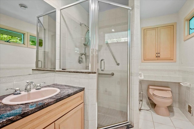 205 Radcliff Dr, Nyack, NY 10960 - full bath featuring tile walls, vanity, plenty of natural light, tile patterned floors, and a shower stall