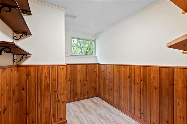 205 Radcliff Dr, Nyack, NY 10960 - empty room featuring wood walls, a wainscoted wall, crown molding, and wood finished floors
