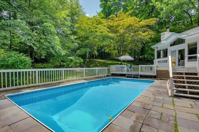 205 Radcliff Dr, Nyack, NY 10960 - view of pool with a wooden deck and view of scattered trees