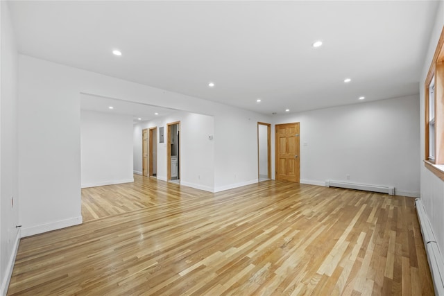 205-06 26th Ave, Bayside, NY 11360 - spare room with a baseboard radiator, light wood finished floors, and recessed lighting