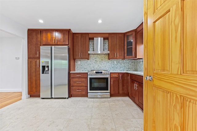 205-06 26th Ave, Bayside, NY 11360 - kitchen with stainless steel appliances, wall chimney exhaust hood, light countertops, decorative backsplash, and glass insert cabinets