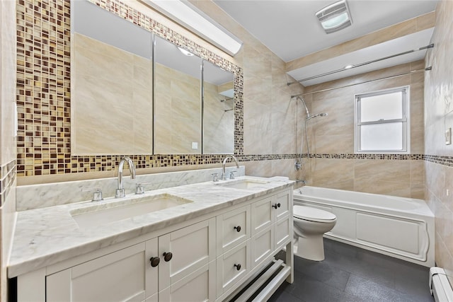 205-06 26th Ave, Bayside, NY 11360 - bathroom with tile walls, a baseboard heating unit, double vanity, and bathtub / shower combination
