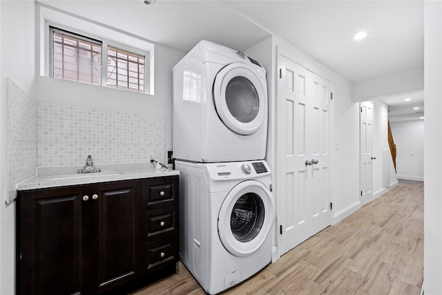 205-06 26th Ave, Bayside, NY 11360 - laundry room featuring estacked washer and dryer, cabinet space, light wood-type flooring, and recessed lighting