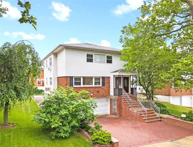 205-06 26th Ave, Bayside, NY 11360 - view of front of property with brick siding, decorative driveway, a front yard, and a garage