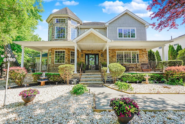 66 Normalee Rd, Staten Island, NY 10305 - view of front of home with covered porch and stone siding