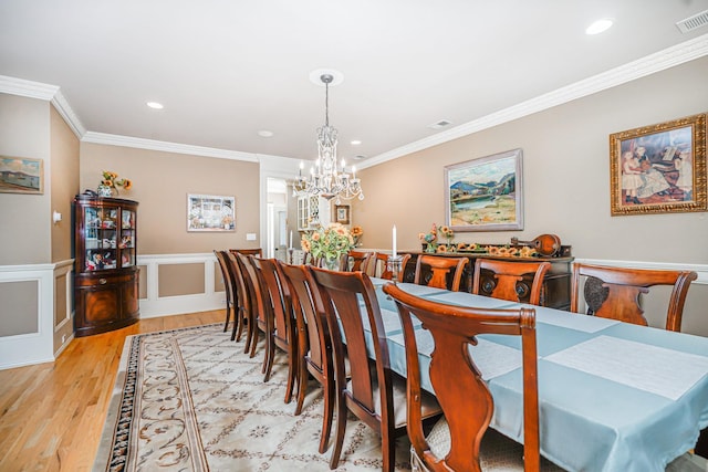 66 Normalee Rd, Staten Island, NY 10305 - dining area with a chandelier, wood finished floors, recessed lighting, crown molding, and wainscoting