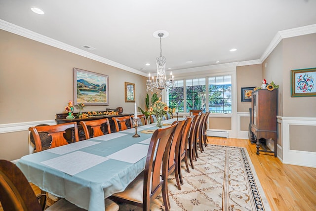 66 Normalee Rd, Staten Island, NY 10305 - dining space featuring a chandelier, light wood-style flooring, recessed lighting, wainscoting, and crown molding