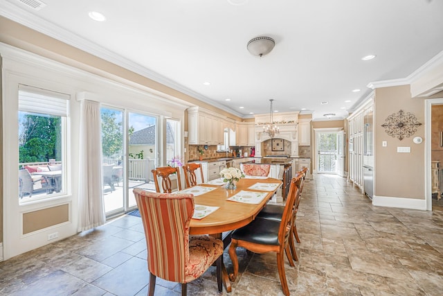66 Normalee Rd, Staten Island, NY 10305 - dining room with healthy amount of natural light, ornamental molding, a chandelier, recessed lighting, and light stone finish floors