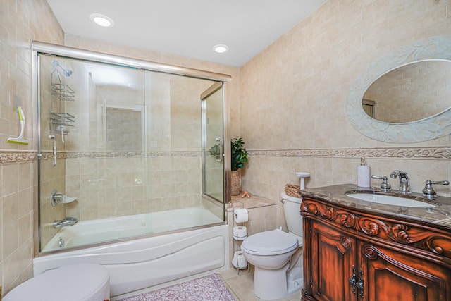 66 Normalee Rd, Staten Island, NY 10305 - full bathroom featuring tile walls, tile patterned flooring, vanity, and bath / shower combo with glass door