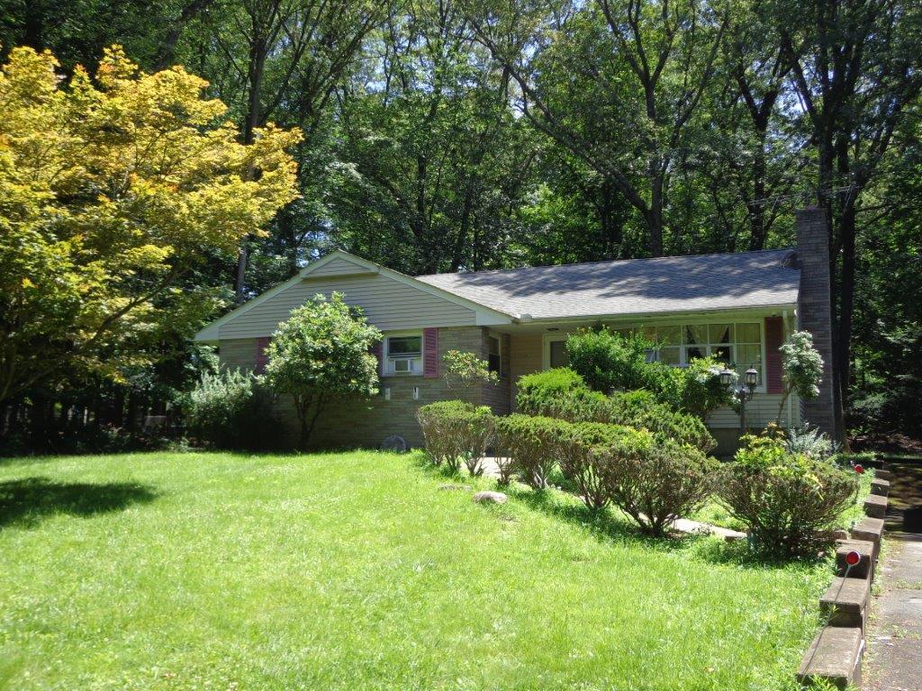 286 Spook Rock Rd, Suffern, NY 10901 - view of front of house featuring a front yard and a chimney