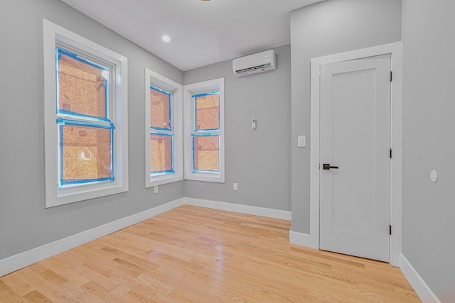 610 Sheffield Ave, Brooklyn, NY 11207 - spare room featuring a wall mounted AC and light wood finished floors