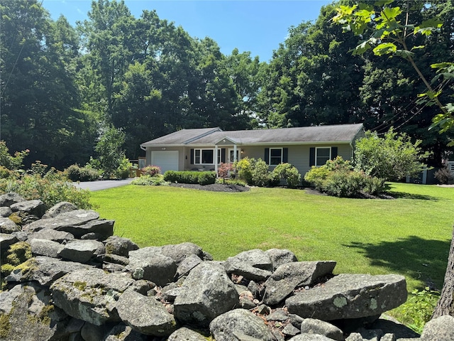 18 Division St, Cornwall, NY 12518 - view of front of house featuring a garage, a front lawn, and driveway