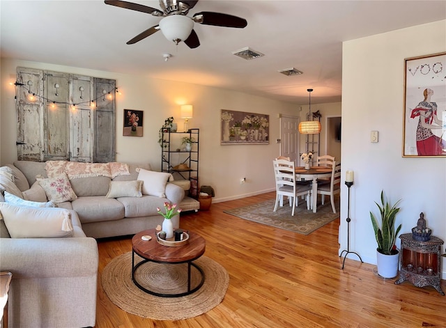 18 Division St, Cornwall, NY 12518 - living area with a ceiling fan and light wood-style flooring