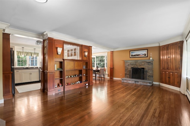 1 Orchard Dr, South Salem, NY 10590 - living area with ornamental molding, dark wood-type flooring, and a stone fireplace