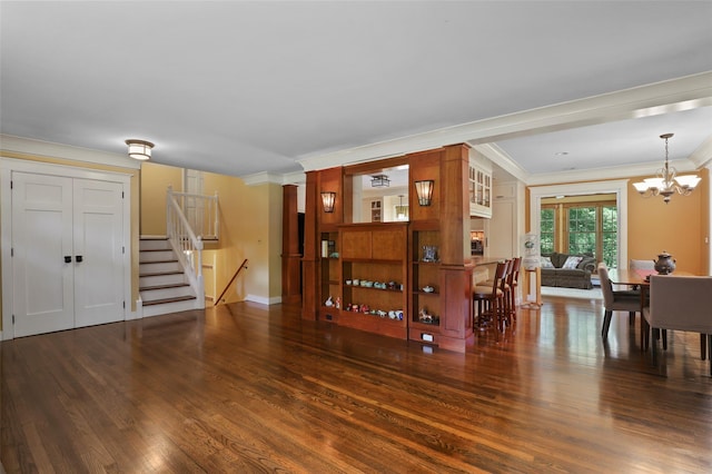 1 Orchard Dr, South Salem, NY 10590 - dining area featuring crown molding, wood finished floors, a chandelier, and stairway
