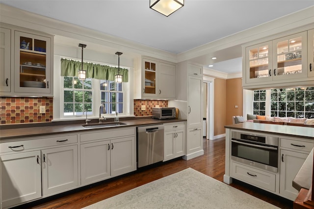 1 Orchard Dr, South Salem, NY 10590 - kitchen featuring stainless steel appliances, ornamental molding, dark wood finished floors, dark countertops, and healthy amount of natural light