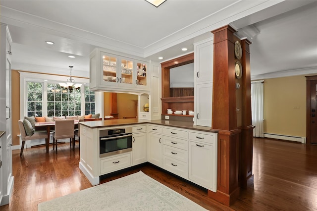 1 Orchard Dr, South Salem, NY 10590 - kitchen with oven, crown molding, a baseboard radiator, glass insert cabinets, and white cabinets