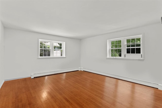 1 Orchard Dr, South Salem, NY 10590 - empty room featuring baseboard heating, healthy amount of natural light, and wood finished floors