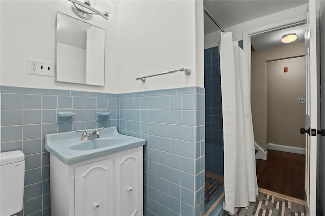 1 Orchard Dr, South Salem, NY 10590 - bathroom featuring tile walls, a tile shower, vanity, wainscoting, and tile patterned floors