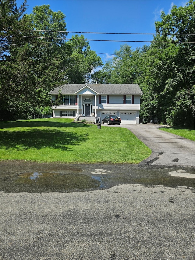 215 Sycamore Dr, New Windsor, NY 12553 - split foyer home with an attached garage, driveway, and a front lawn