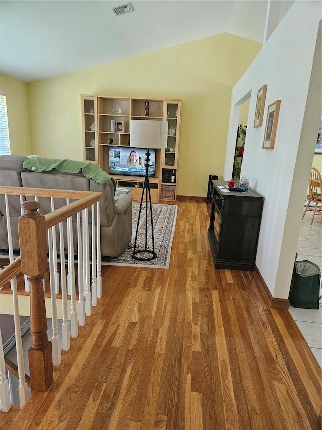 215 Sycamore Dr, New Windsor, NY 12553 - living room with light wood-style floors and vaulted ceiling