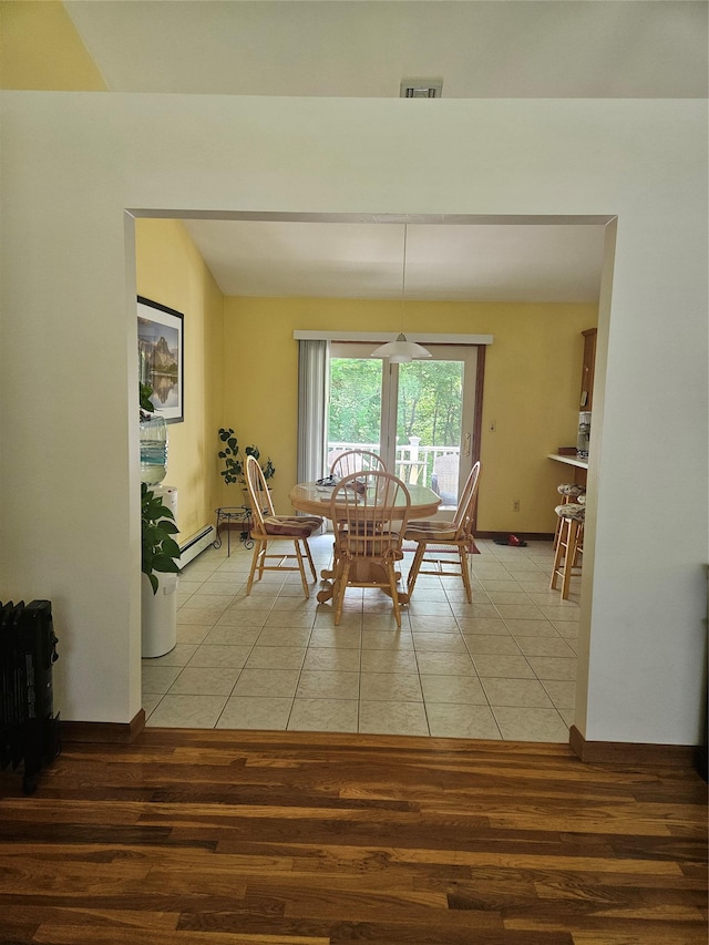 215 Sycamore Dr, New Windsor, NY 12553 - dining room with light tile patterned flooring and a baseboard radiator