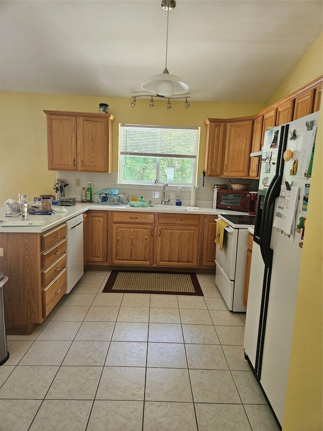 215 Sycamore Dr, New Windsor, NY 12553 - kitchen featuring white appliances, tasteful backsplash, light countertops, and light tile patterned floors