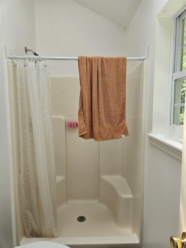 215 Sycamore Dr, New Windsor, NY 12553 - bathroom featuring a stall shower and vaulted ceiling