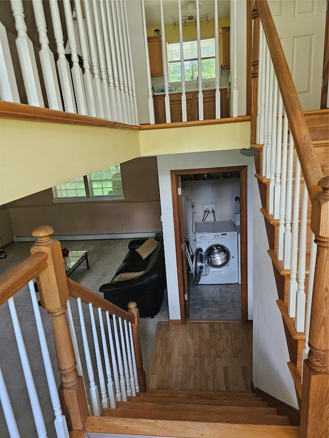 215 Sycamore Dr, New Windsor, NY 12553 - stairway with washer / dryer and wood finished floors