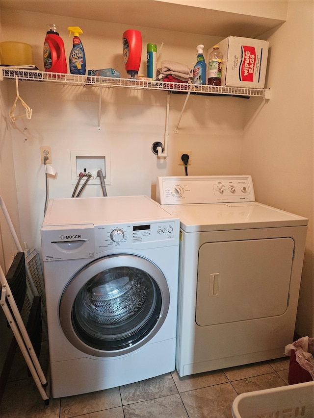215 Sycamore Dr, New Windsor, NY 12553 - laundry room featuring washing machine and dryer and light tile patterned flooring
