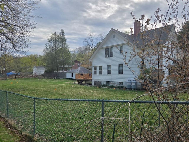 29 Fulton St, Monticello, NY 12701 - view of home's exterior featuring a chimney and a fenced backyard