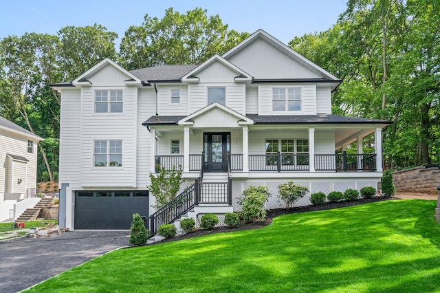 32 Middleville Rd Unit 2, Northport, NY 11768 - view of front of home with stairs, covered porch, an attached garage, driveway, and a front yard